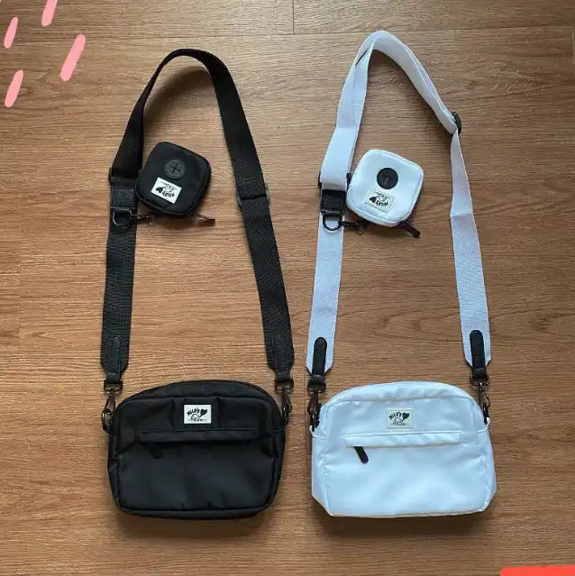 Two crossbody bags with attached coin purses.